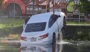 Stolen Car Rolls Into Sunrise Canal