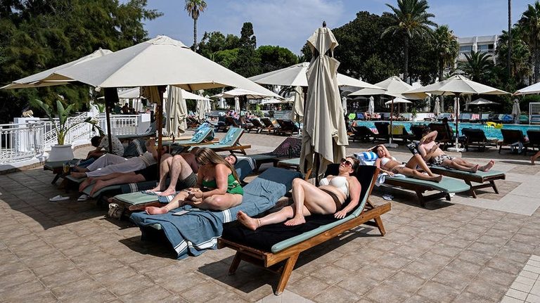 Tourists Rush For Pool Lounge Chairs