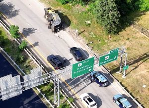 Trash Truck Rollover Causes Traffic Backup