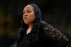 Virginia Coach Reaches Settlement