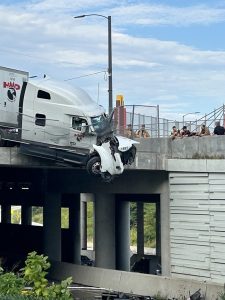 Semi Truck Crashes Through Overpass Barrier On Martin Luther King Drive In Avond