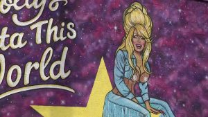 Tampa Artist Completes Dolly Parton Mural On Local Business Wall
