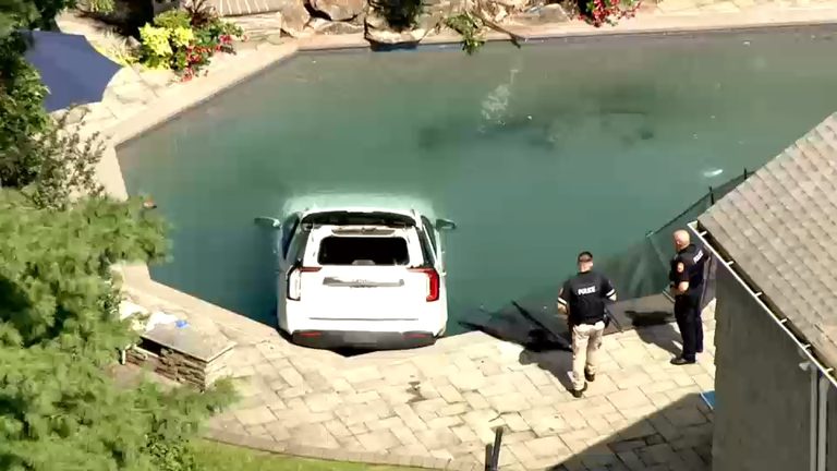 White Suv Submerged After Crashing Into Backyard Pool In Hewlett Nassau County