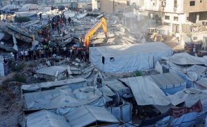 Gaza Rescue Teams Dig Through Collapsed Building 12 Dead As Humanitarian Crisis