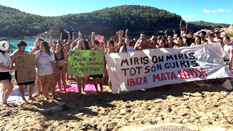 Ibiza Youth Block Cala Saladeta Beach To Protest Overtourism