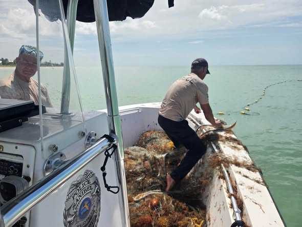 Sanibel Police Officers Remove 500 Feet Of Illegal Netting Rescue Trapped Marine