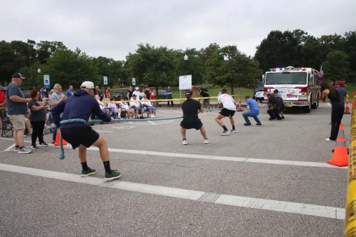 Shawnee Community Pulls Fire Truck And Police Vehicle To Raise Funds For Special
