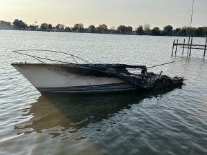 Charred Boat Remains On Ottawa River Near Toledo Three Months After Fire