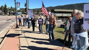 No Kings Early Voting Rally Draws Hundreds To Woodland Park Intersection